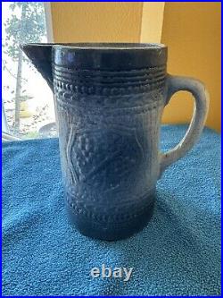 Antique McCoy Pottery 7 Salt Glazed Stoneware Pitcher withMedieval Shield Decor