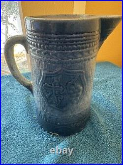 Antique McCoy Pottery 7 Salt Glazed Stoneware Pitcher withMedieval Shield Decor