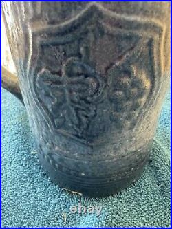 Antique McCoy Pottery 7 Salt Glazed Stoneware Pitcher withMedieval Shield Decor