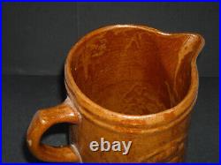Early (1905 1925) Brown Girl with Dog Stoneware Pitcher